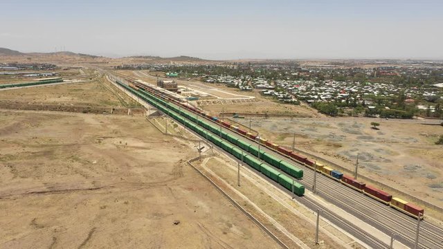 Africa infrastructure development - drone flight of cargo train carriages on newly built Ethiopia - Djibouti railway line built by Chinese company