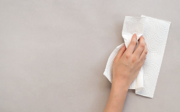 Woman Wiping Table With Paper Towel	