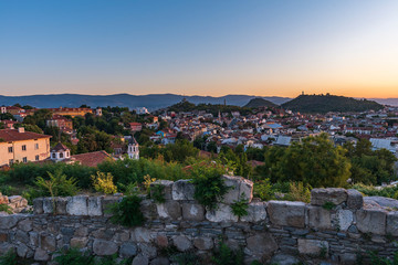 Warm summer sunset from Nebet tepe Hill in Plovdiv city, Bulgaria. Panoramic view from the oldest...