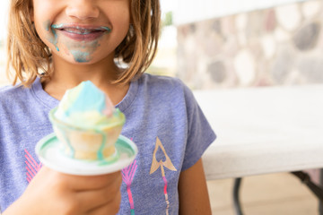 Girl Eating a Colorful Ice Cream Cone