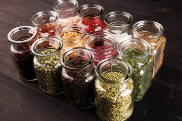 assortment of spices in glass on table. Food and cuisine ingredients and peppers