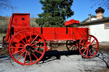 Fototapeta na wymiar Historic Red Chuckwagon in Vintage Outdoor Village