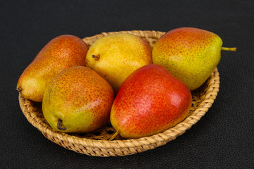 Pear heap in the wooden basket