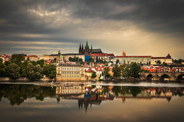 Fototapeta premium Beautiful Vltava river in Prague with old town and historical buildings in the background