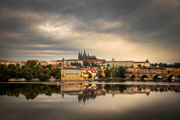Beautiful Vltava river in Prague with old town and historical buildings in the background