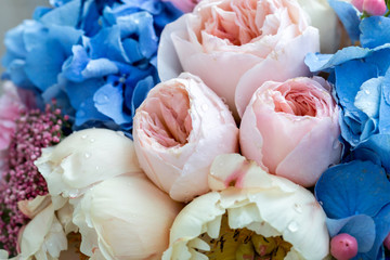 Bouquet of gentle peony flowers. Flower background with amazing pink and creamy peonies.