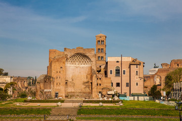 Fototapeta premium Ruins of the Temple of Venus and Roma located on the Velian Hill and Arch of Titus