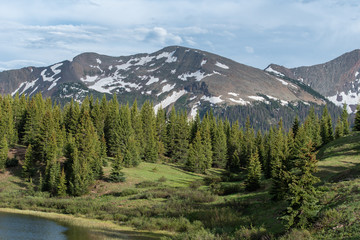 lake, trees, meadow, mountains and snow at Little Molas Lake in the San Juan Mountains of Colorado