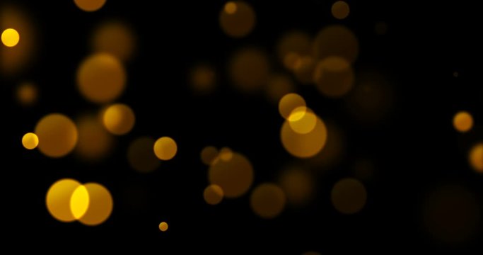 abstract gold glow particles bokeh flowing effect on black background, holiday happy new year event