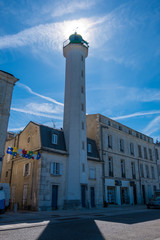 Fototapeta na wymiar The lighthouse of Quai Valin in the Old Port of La Rochelle, France