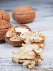 Fototapeta na wymiar Fresh walnuts on the wooden background