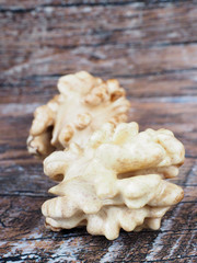 Fresh walnuts on the wooden background