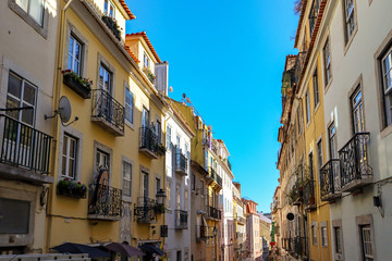 Fototapeta na wymiar View to the Bairro Alto district in the historic center of Lisbon, traditional facades in the streets of the old town, Portugal Europe