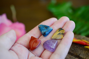 Crystal Medicine Bag; Chrysocolla, Amethyst, Red Jasper, and Ocean Jasper! Small, pocket sized crystal bundle. Great for meditation and reiki energy healing. Yogi crystals in woman's hand. 
