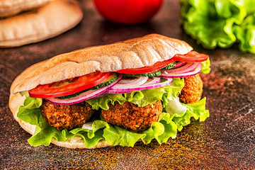 Falafel and fresh vegetables in pita bread.