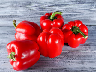 Red Peppers on the wooden background