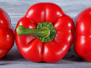 Red Peppers on the wooden background