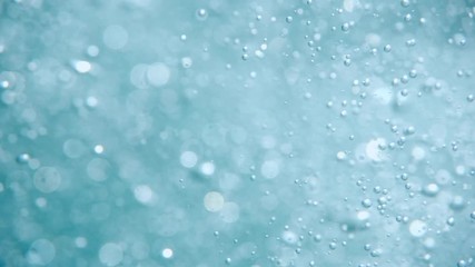 Bubbles rising to the surface. Air bubbles in water in sea (underwater shot), good for backgrounds. Slow motion.