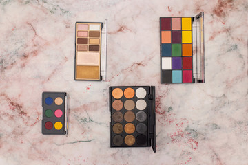 Eye shadow palettes for woman make up on the table 