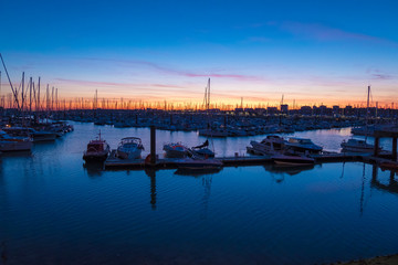 Fototapeta na wymiar Colorful sunset in the old harbor of La Rochelle, France