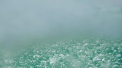Bubbles rising to the surface. Air bubbles in water in sea (underwater shot), good for backgrounds. Slow motion.