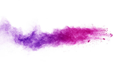 Freeze motion of purple color powder exploding on white background.