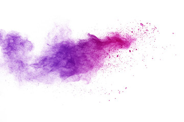 Freeze motion of purple color powder exploding on white background.