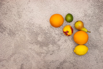 Fresh and organic fruits on the right side of gray background 