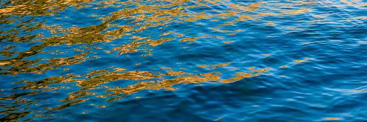 Golden Reflection and Glare on the Surface of Sea Waves.