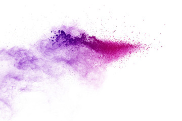 Freeze motion of purple color powder exploding on white background.
