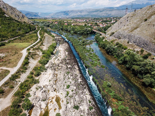 Fototapeta na wymiar The Confluence of Neretva and Buna River have remarkable river gorge along with tufa waterfalls, Mostar, Bosnia and Herzegovina