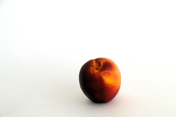 Red-yellow peach fruits on a white background. Summer background.