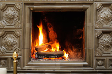 Close up shot of burning firewood in the fireplace