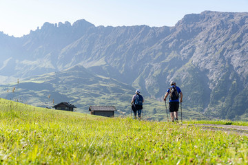 Two people hiking on the Seiser alm in south tyrol