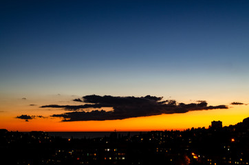 A stretched dark cloud over the city