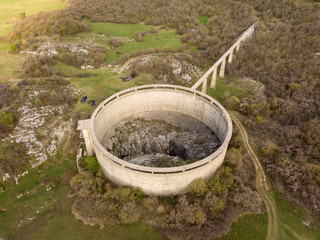 Slivski ponor is a ponor or a sinkhole with a huge shaft on Niksicko polje close to Niksici in Montenegro. A circular dam that is preventing outflow of water from the polje surrounds the cave. 