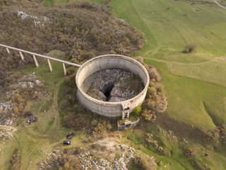 Slivski ponor is a ponor or a sinkhole with a huge shaft on Niksicko polje close to Niksici in Montenegro. A circular dam that is preventing outflow of water from the polje surrounds the cave. 