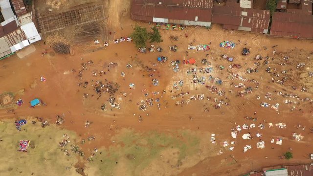 Overhead drone shot of people buying and selling fresh groceries at local market in Dorze, a small tribe living in the mountains near Arba Minch in South Ethiopia
