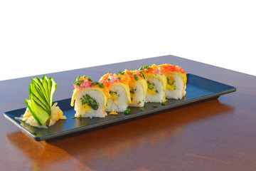 Vegetarian sushi roll with mango, cucumber, parsley.