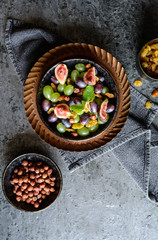 Fruit salad with green and red grapes, jumbo golden raisins, figs and hazelnuts