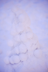 cute snowy snowman in the evening at the christmas city with nobody
