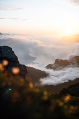 sunset in the mountains with a lake (walensee) under the clouds sea