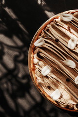 Coffee cream tart, dessert, cake. Sweet life concept. Vertical photo.