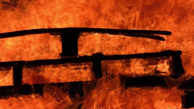 Wood burns in strong fire and high blaze