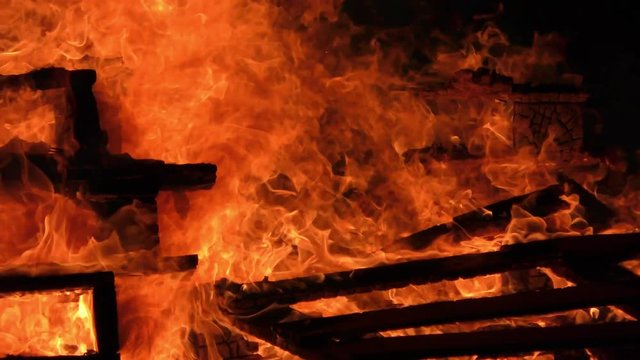 Wood burns in strong fire and high blaze
