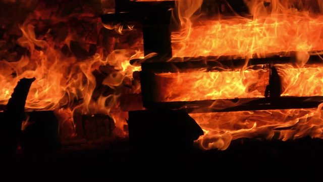 Wood burns in strong fire and high blaze