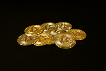 Bitcoins, gold on black