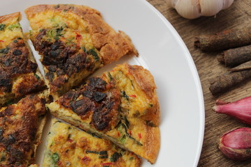 omelette on wooden background view from above
