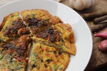 omelette on wooden background view from above