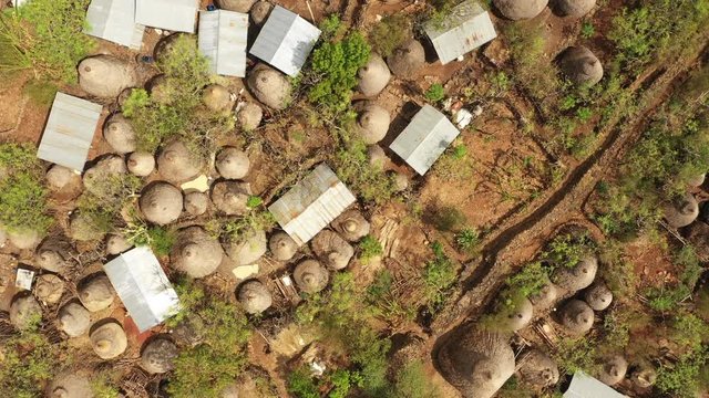 Africa rural landscapes - flying over huts and homes made of corrugated sheet in traditional tribal village of Konso in South Ethiopia